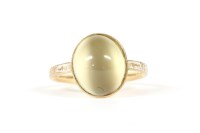 Lot 34 - A gold single stone quartz cats eye memorial ring