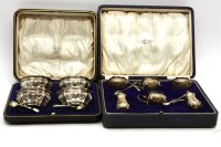 Lot 223 - A cased set of four silver mustard pots and spoons