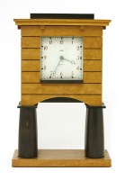 Lot 471 - A maple and ebonised clock