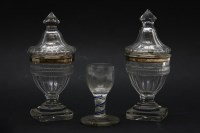 Lot 143 - A pair of 18th century cut glass sweetmeat dishes and covers each with silver mounts and on octagonal to square stepped base