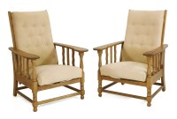 Lot 134 - A pair of Arts and Crafts reclining armchairs