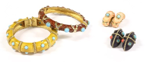 Lot 1527 - Two gold-plated and enamel hinged bangles