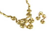 Lot 1530 - A gold-plated scroll link necklace and earring suite
