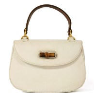 Lot 1175 - A vintage Gucci white leather handbag