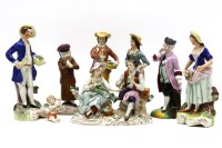 Lot 350 - A 19th century Sitzendorf porcelain figure group of a courting couple sat on a tree trunk