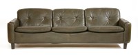 Lot 668 - A brown leather three-seater sofa