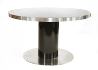 Lot 492 - A black and chrome circular dining table