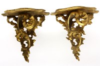 Lot 351 - A pair of carved wood and gilt wall brackets