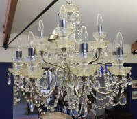 Lot 345 - A pair of cut glass twelve light chandeliers