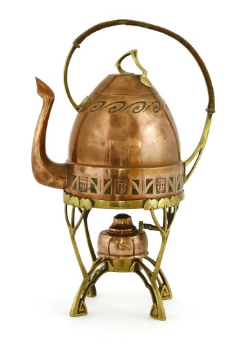 Lot 9 - A Carl Deffner copper and brass kettle on stand
