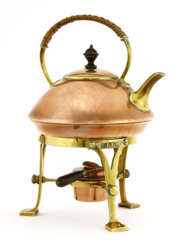 Lot 65 - An Arts and Crafts copper and brass kettle on stand