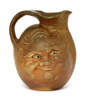 Lot 51 - A Martin Brothers' brown-glazed mask jug
