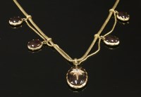 Lot 22 - A Victorian gold garnet and diamond swag necklace
