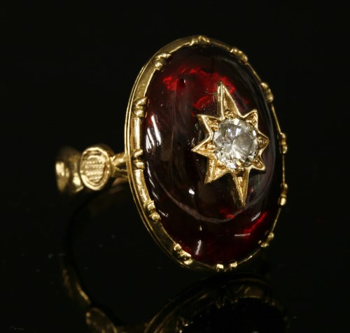 Lot 20 - A diamond and garnet ring