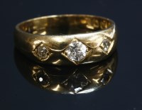Lot 68 - A gentlemen's 18ct gold three stone diamond ring