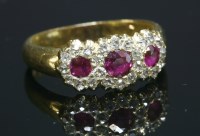 Lot 83 - An Edwardian ruby and diamond triple cluster ring