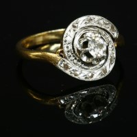 Lot 123 - A Belle Époque diamond set tourbillon ring