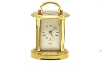 Lot 259 - A Rapport oval brass carriage clock