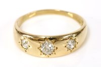 Lot 153 - An 18ct gold three stone star set diamond ring