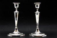 Lot 235 - A pair of antique silver candlesticks