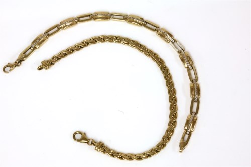 Lot 167 - A 9ct gold two colour hollow open and panel link bracelet