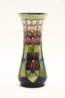 Lot 314 - A Moorcroft 'Violets' pattern vase