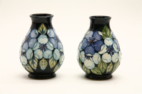 Lot 450 - A near pair of Moorcroft 'Tudor Rose' vases