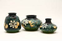 Lot 264 - Three Moorcroft 'Passion Fruit' vases
