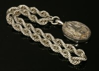 Lot 105 - A sterling silver Victorian oval hinged locket and chain