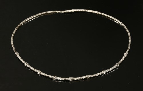 Lot 419 - An Italian white gold diamond set curved necklace