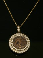 Lot 2 - A Georgian split pearl circular glazed pendant