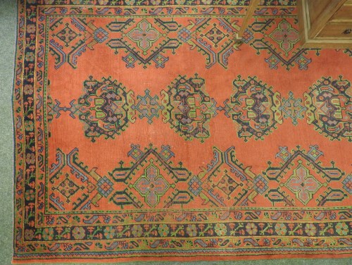 Lot 640 - A red ground Turkey carpet