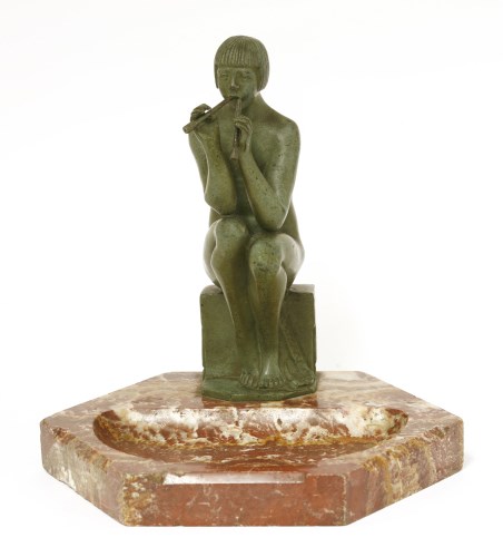 Lot 286 - A patinated bronze nude figure playing pan pipes