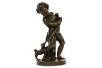 Lot 275 - A bronze of a putti with a puppy