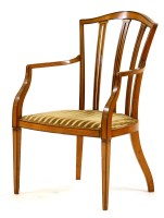 Lot 653 - An Edwardian satinwood elbow chair