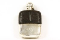 Lot 198 - A silver and leather mounted hip flask