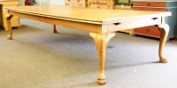 Lot 572 - A large oak draw leaf dining table
