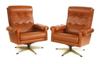 Lot 394 - A pair of Danish tan leather lounge armchairs
