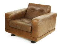 Lot 555 - A Danish brown leather armchair