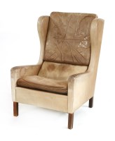 Lot 556 - A Danish tan leather armchair