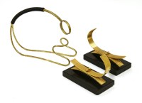 Lot 511 - A pair of gold-plated bookends
