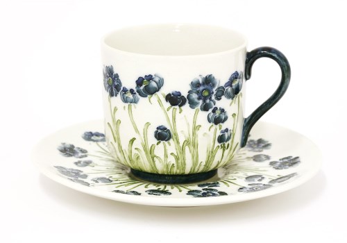 Lot 93 - A Moorcroft Macintyre pottery 'Poppy' cup and saucer