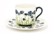 Lot 93 - A Moorcroft Macintyre pottery 'Poppy' cup and saucer