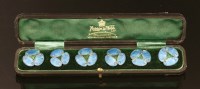 Lot 110 - A cased set of six Art Nouveau silver enamel buttons