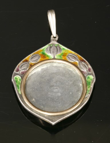 Lot 112 - A silver and enamelled picture locket pendant by William Hair Haseler