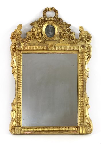Lot 32 - A carved giltwood wall mirror