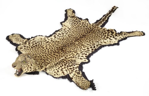 Lot 33 - A leopard-skin rug