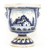 Lot 16 - A tin-glazed blue and white pottery urn