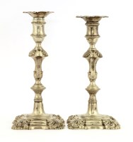 Lot 354 - A pair of George III cast silver candlesticks