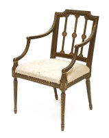 Lot 175 - A Sheraton period beechwood elbow chair